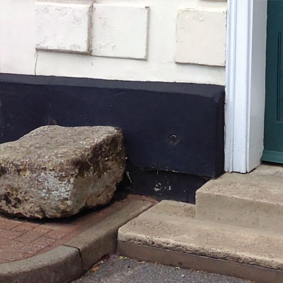 Stone block at the Shirehall entrance Holt Owl Trail